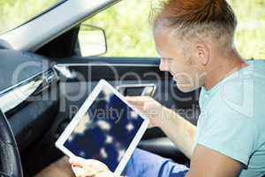 Man with Tablet PC and automotive