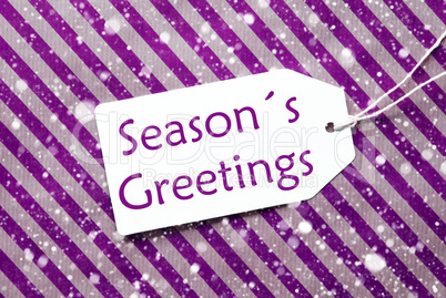 Label On Purple Wrapping Paper, Snowflakes, Text Seasons Greetings