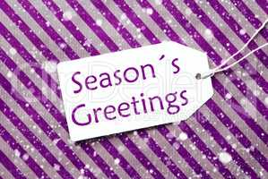 Label On Purple Wrapping Paper, Snowflakes, Text Seasons Greetings