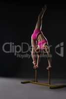 Tightrope walker training. Photo on gray backdrop