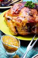 Roasted chicken on wooden plate