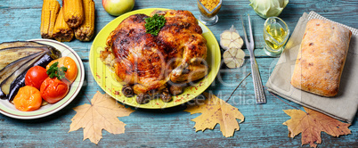 Roasted chicken on wooden plate