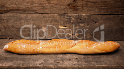 Delicious baguette bread on wood