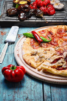 Pizza and baked vegetables