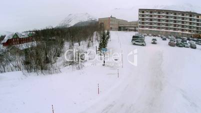 Car Driving out the Parking and Heading to Mountains