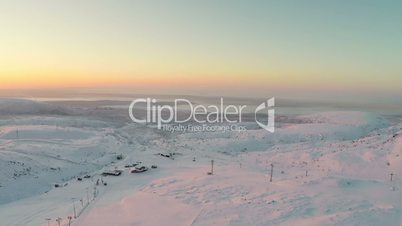 Aerial Shot of Sunrise in Winter Mountains