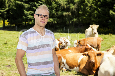 Young farmer with cattle