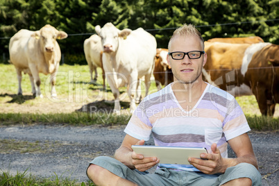 Young farmer with cattle