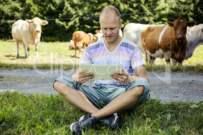 Young farmer with cattle