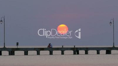Cinemagraph - Sun Setting over the Sea Pier