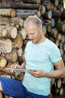 Man in the woods with Tablet PC