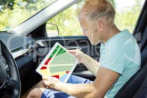 Man with Tablet PC and automotive