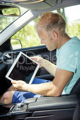 Man with Tablet PC and automotive