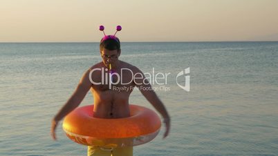 Humorous dancing on the beach