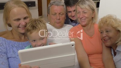 Big family watching something on touch pad