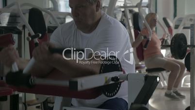 Man working out on biceps in the gym