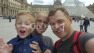 Family making selfie video near the Louvre
