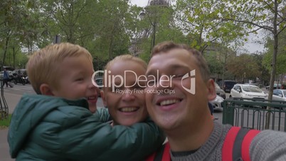 Family of tourists making selfie video in Paris