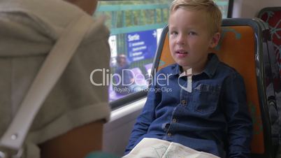 Child with map in commuter train