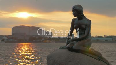 The Little Mermaid statue at sunset