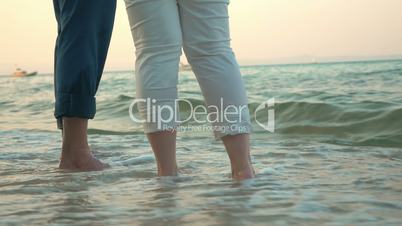 Barefoot man and woman on the beach