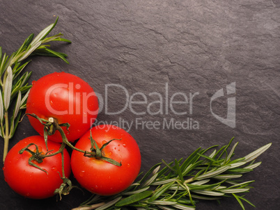 Fresh tomatoes with rosemary