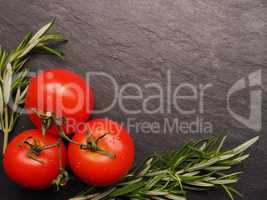 Fresh tomatoes with rosemary