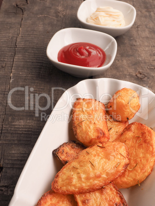 Rosemary potatoes with ketchup and mayonnaise