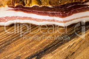 Smoked Bacon on Vintage Wooden Board