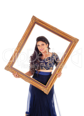 Pretty woman holding picture frame.