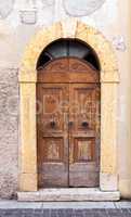 Weathered wooden doors in Italy