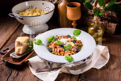 Ribbon Pasta with zucchini and olives in tomato sauce