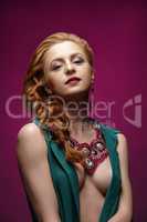 Photo of sexy redhead woman posing in jewelry