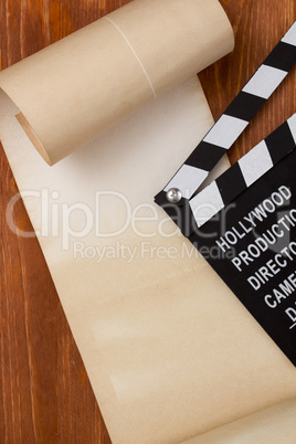 Clapper for film and paper scroll