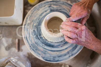 Close-up of potter making pot