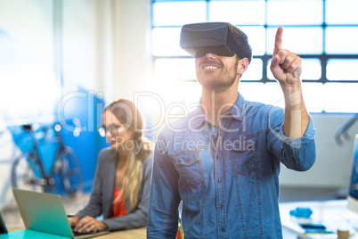 Male graphic designer using the virtual reality headset