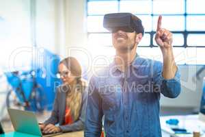 Male graphic designer using the virtual reality headset