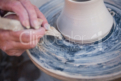 Close-up of potter making pot