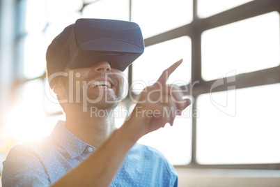 Male business executive using virtual glasses