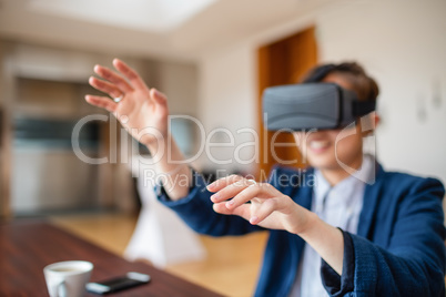 Young woman using virtual reality glasses