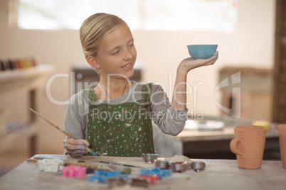 Smiling girl looking at bowl