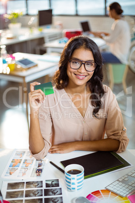 Businesswoman holding a credit card