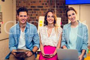 Business people using laptop, mobile phone and digital tablet