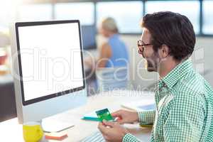 Graphic designer doing online shopping