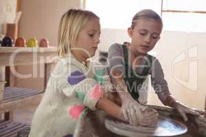 Two girl making pot