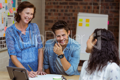 Business people interacting in office