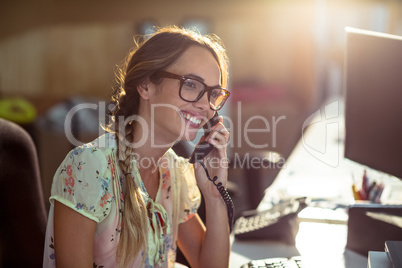 Smiling woman talking on phone