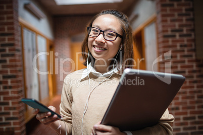 Young woman listening song on mobile phone