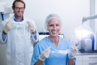 Portrait of dentist and dental assistant wearing surgical mask
