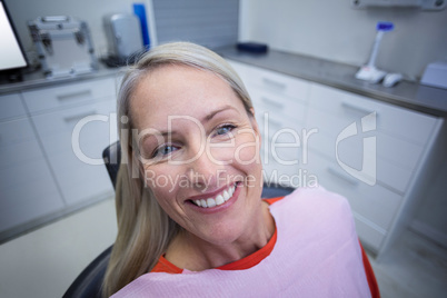 Female patient sitting on dentist chair
